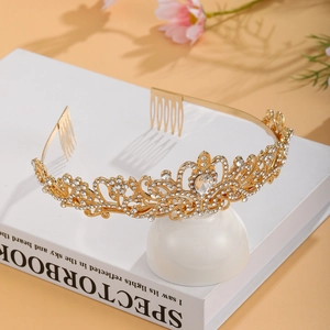 Detail showing crystal rhinestone bridal tiara with gold alloy finish and comb teeth