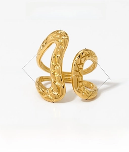 Macro detail of polished gold irregular geometric ring with 22mm and 11mm width dimensions