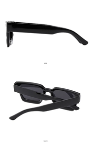 Detail view of glossy black rectangle sunglasses showing the side and back frames