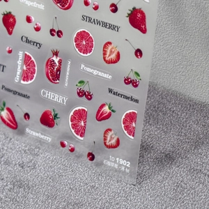 Macro view of ultra-thin 5D nail art stickers featuring realistic fruit patterns and texture
