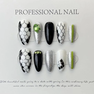 Handmade press-on nails set featuring green gems, snake patterns and silver glitter tips