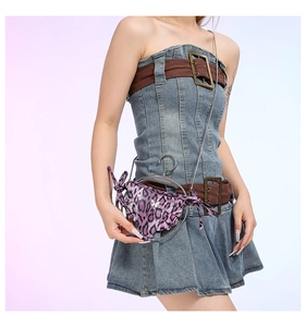 Detail of purple leopard print bag with silver metal ring and Fashion & Bags engraving