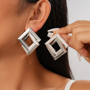 Minimalist geometric rhombic silver-toned crossover earrings for a bold look