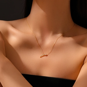 Detailed close-up of a gold S925 silver necklace featuring a crescent pendant with pavé diamonds