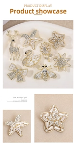 Detailed view of luxury zircon brooches in swan and bow shapes with sparkling crystals