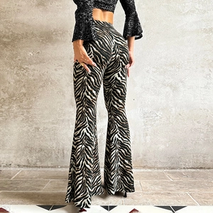 Back view of high-waisted zebra print flare pants with slim fit and wide leg style