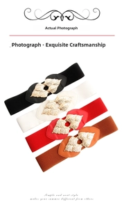 Detail of four elastic waist belts with golden leaf buckles in black, white, red, and brown