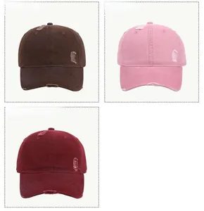 Detailed view of distressed baseball caps in coffee, pink, and wine red colors