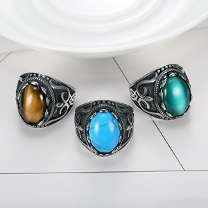 Vintage men's silver rings set with turquoise, tiger eye, and green cat eye stones
