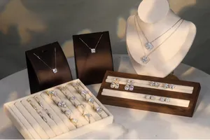 Detailed luxury jewelry collection including clover necklaces and sparkling diamond rings
