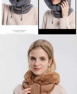 Detail of knitted winter hood with faux fur trim and adjustable drawstring in gray and brown