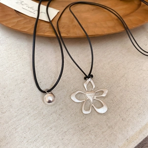 Silver hollow flower and matte ball pendant on black cord necklaces for women