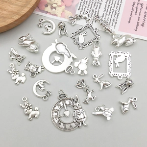 Macro shot of assorted vintage silver bunny pendants for DIY jewelry and accessories