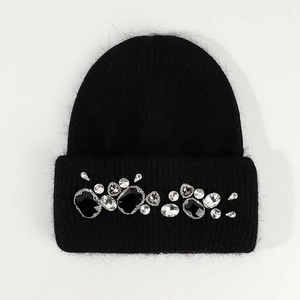 Detail of black knit beanie with sparkling rhinestones and soft angora rabbit hair texture