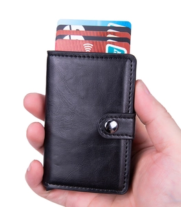 Handheld view of a black crazy horse PU leather wallet with RFID blocking card holder