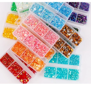 Macro shot of 6-slot storage boxes with colorful flatback jelly resin nail art rhinestones