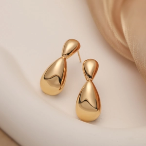 Polished 18K gold plated teardrop earrings on beige silk, minimalist jewelry for women