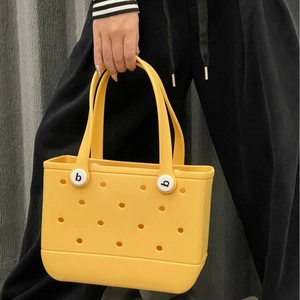 Waterproof bright yellow EVA beach tote bag with perforated holes and sturdy handles