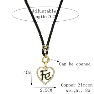 Detailed view of adjustable 70cm black cord necklace with gold heart locket dimensions