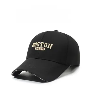 Detail of Boston 1630 beige embroidery on black breathable cotton baseball cap