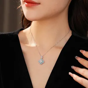 S925 silver necklace featuring a blue diamond flower pendant worn by a model
