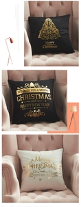 Detail of velvet Christmas pillow covers with gold foil tree patterns on a pink sofa