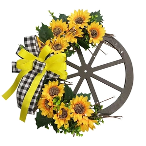 Rustic wooden wheel wreath with artificial sunflowers and black white buffalo plaid bow