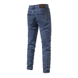 Rear view of men's casual blue denim jeans showing pockets and waist leather patch detail