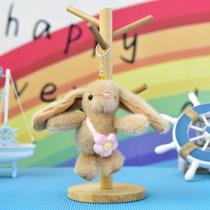 Adorable brown plush rabbit doll keychain with small pink flower bag decoration
