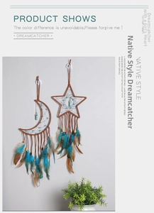 Close-up of moon and star dreamcatcher set with peacock blue feathers and turquoise