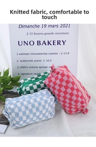 Macro view of checkered knitted cosmetic bags in pink, green, and blue with zipper detail