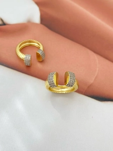 Detail of adjustable gold ring with silver micro-paved crystals and vertical stripes
