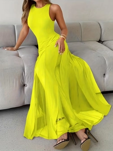 Elegant neon yellow sleeveless maxi dress with slit hem and side cutouts for beach events