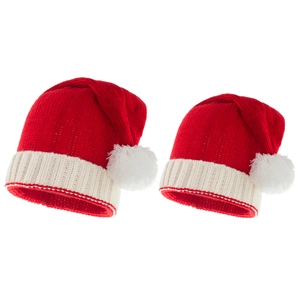 Matching red and white winter knit Christmas hats with white pom poms for mom and baby