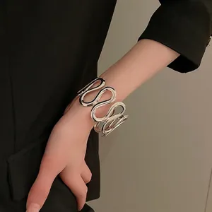 Minimalist silver wavy wide cuff bracelet for women with polished finish and modern design