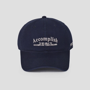 Detail of high-quality navy cotton baseball cap with intricate Accomplish embroidery text