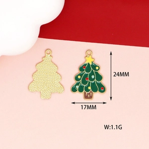 Detail of green enamel Christmas tree pendant showing size 24x17mm and gold metal back