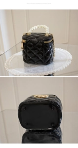 Detailed view of mini jelly bag featuring quilted patterns and faux pearl handle