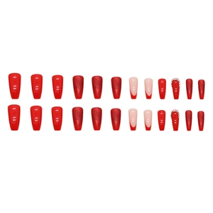 Sparkly red coffin nails set with glitter and rhinestone accents on white background