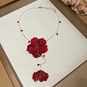 Romantic fabric flower necklace with deep red petals and crystal beads on gold chain