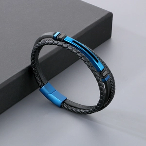 Detail of double-layer men's bracelet with black woven leather and blue metal magnetic clasp