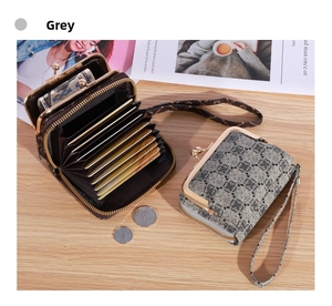 Detail view of grey patterned wallet with gold kiss-lock pocket and accordion card slots
