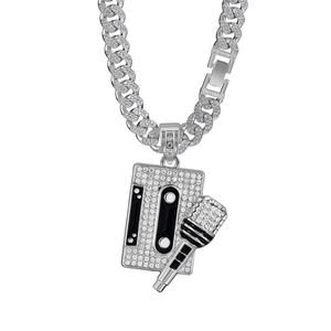 Detailed close-up of silver Cuban chain with diamond-set cassette and microphone pendant