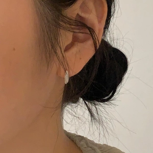 Minimalist 925 sterling silver hoop earrings with a textured hammered silver finish