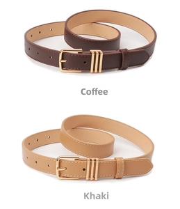 Detail of dark brown and khaki slim PU leather belts with gold pin buckles and neat stitching