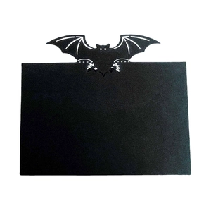 Halloween black bat place card holder with matte finish and white eye accents on white background