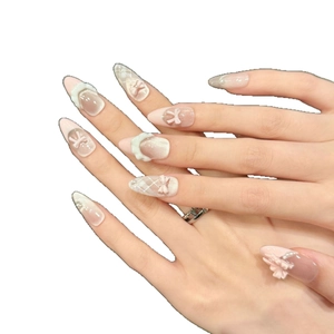 Faux ongles œil de chat rose avec nœuds 3D et perles forme amande longue