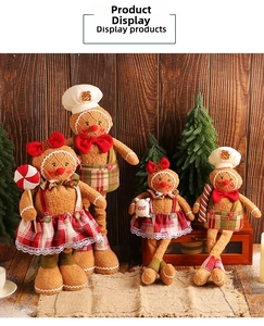 Close-up of plush gingerbread man figurines with red and green checkered festive outfits