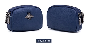 Detail of royal blue pebble leather coin purse with double zippers and silver bee motif