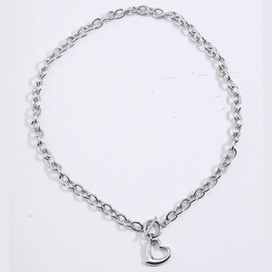 Minimalist stainless steel heart pendant necklace with toggle clasp on white background